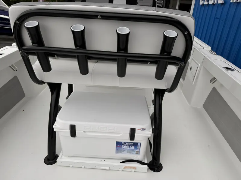 Slide: The Image of 2025 Parker 23SE Center Console boat with rod holders and cooler. - 6