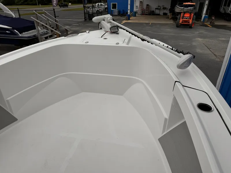 Slide: The Image of 2025 Parker 23SE Center Console boat, white interior, docked at marina. - 8
