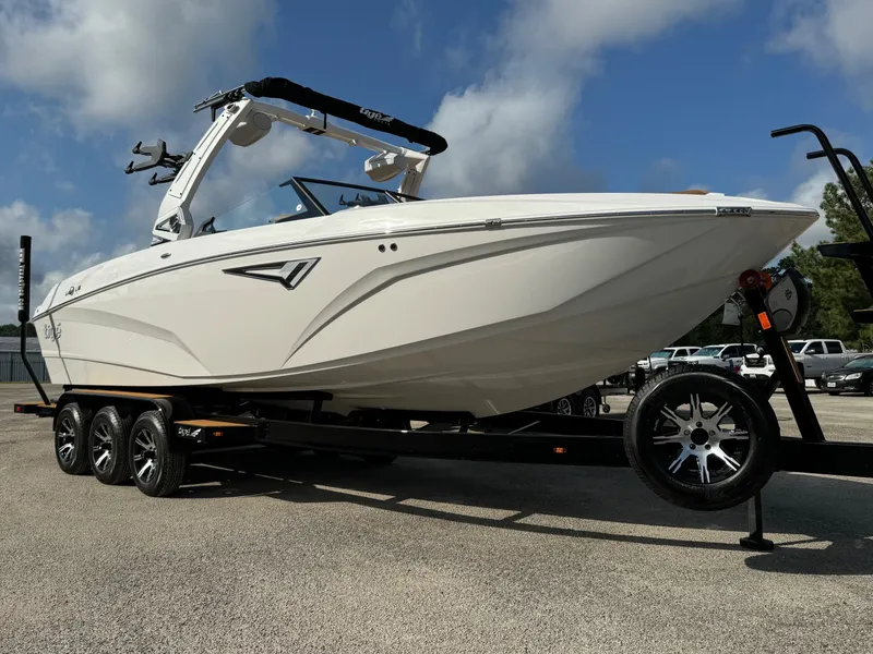 The Image of 2025 Tigé Z5 boat on trailer under blue sky. - 0