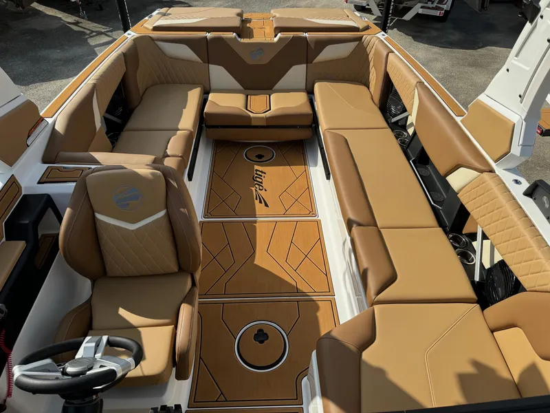 Slide: The Image of 2025 Tigé Z5 boat interior with tan leather seating and stylish flooring. - 10
