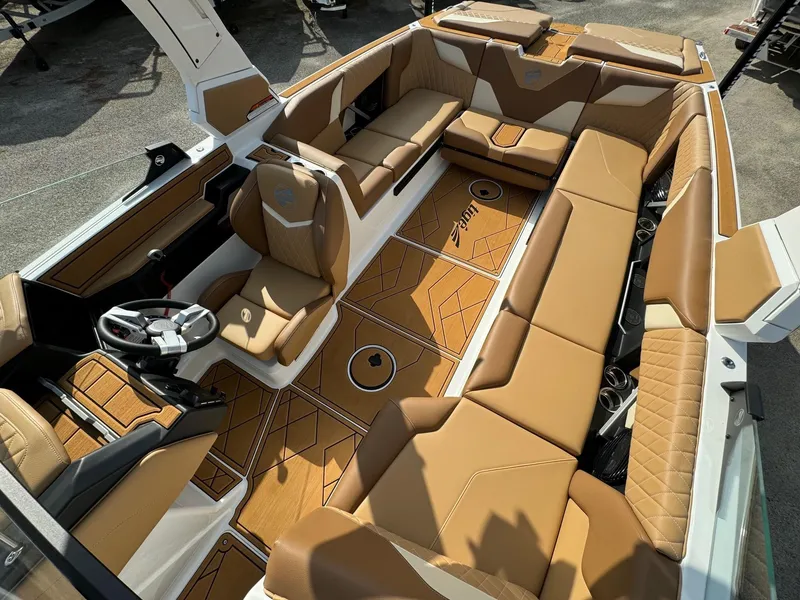 Slide: The Image of Luxurious interior of 2025 Tigé Z5 boat with tan leather seating and modern design. - 11