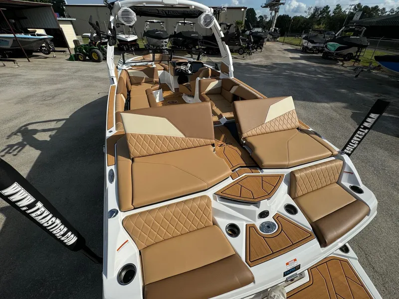 Slide: The Image of 2025 Tigé Z5 boat with luxurious tan seating and modern design. - 7