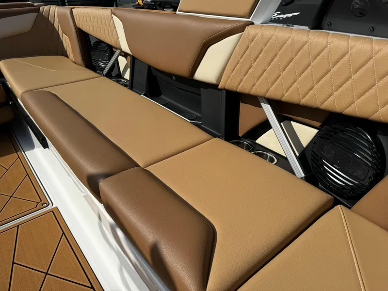 Slide: The Image of Luxurious seating on 2025 Tigé Z5 boat with tan and brown upholstery. - 9