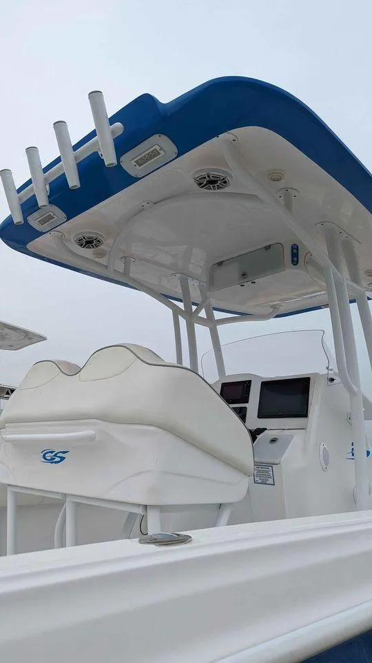 Slide: The Image of 2022 Glasstream 280 Pro-XS boat with blue canopy and white seating. - 3