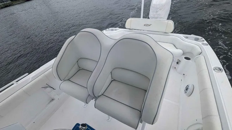 Slide: The Image of 2022 Glasstream 280 Pro-XS boat with white cushioned seating on the deck. - 9