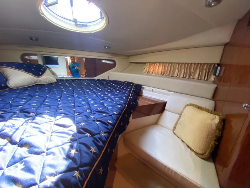 Slide: The Image of Luxurious cabin interior of 2006 Regal 3560 Commodore yacht with plush bedding. - 28