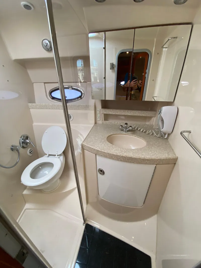 Slide: The Image of 2006 Regal 3560 Commodore yacht bathroom with modern fixtures and compact design. - 29