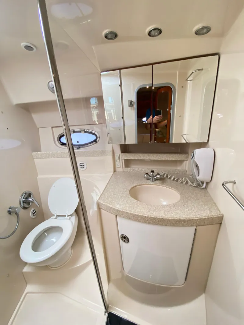 Slide: The Image of 2006 Regal 3560 Commodore bathroom with sink, toilet, and mirror. - 31