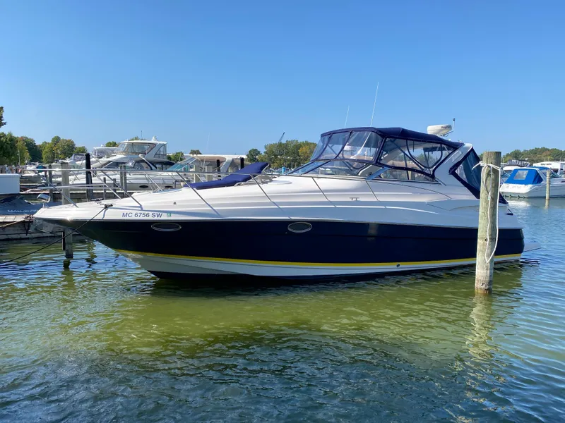 Slide: The Image of 2006 Regal 3560 Commodore boat docked in marina under clear blue sky. - 6