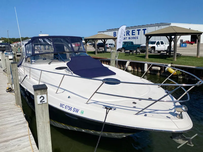 Slide: The Image of 2006 Regal 3560 Commodore yacht docked at marina, sunny day. - 7