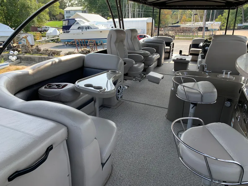 Slide: The Image of Luxurious 2013 Premier 310 Boundary Waters Sky Dek boat interior with plush seating and modern amenities. - 11