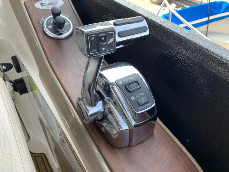 Slide: The Image of Close-up of 2013 Premier 310 Boundary Waters Sky Dek boat throttle controls. - 22