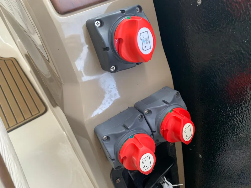 Slide: The Image of Red switches on a 2013 Premier 310 Boundary Waters Sky Dek boat. - 23