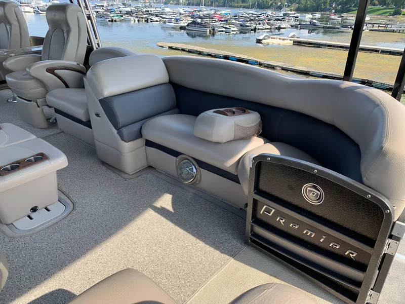 Slide: The Image of 2013 Premier 310 Boundary Waters Sky Dek pontoon boat interior with plush seating. - 27