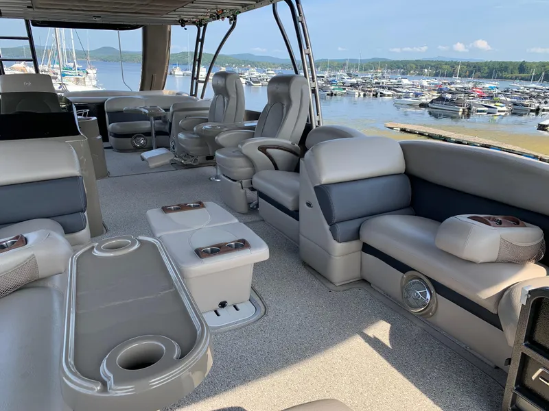 Slide: The Image of 2013 Premier 310 Boundary Waters Sky Dek pontoon boat with spacious seating and lake view. - 28