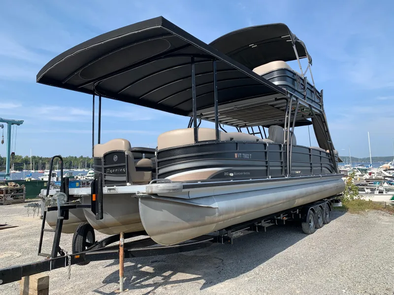 Slide: The Image of 2013 Premier 310 Boundary Waters Sky Dek pontoon boat on trailer. - 3