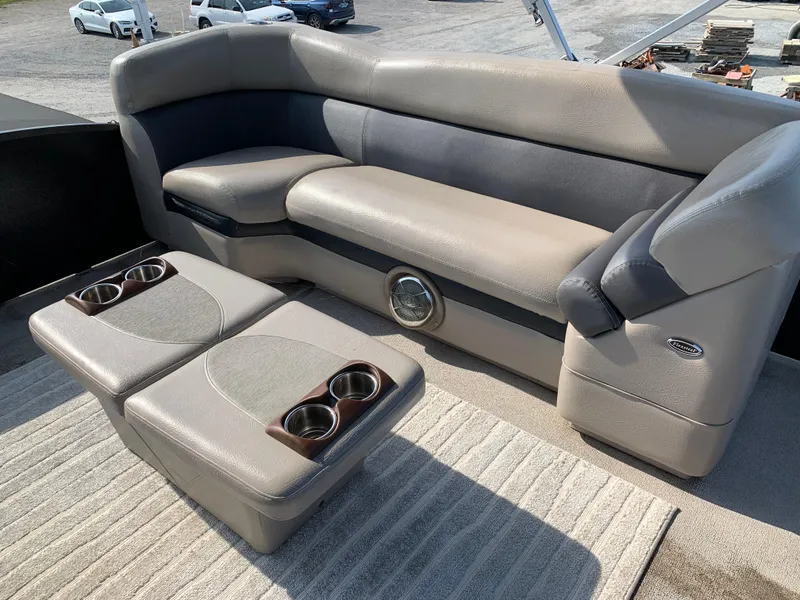 Slide: The Image of 2013 Premier 310 Boundary Waters Sky Dek boat seating with cup holders and speaker. - 32