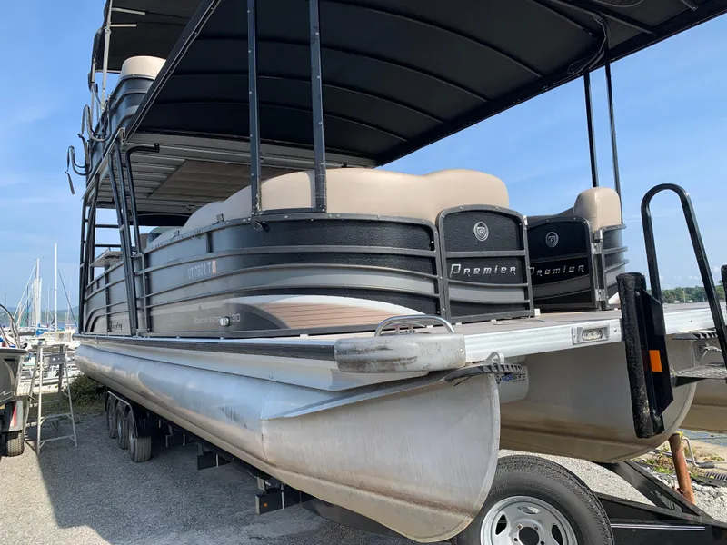 Slide: The Image of 2013 Premier 310 Boundary Waters Sky Dek pontoon boat on trailer. - 5