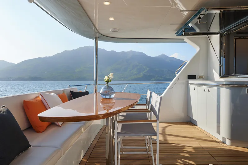 Slide: The Image of Luxurious 2024 CL Yachts CLB65 yacht interior with elegant seating and scenic ocean view. - 16