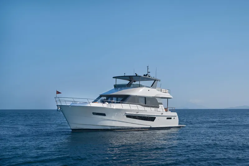 Slide: The Image of 2024 CL Yachts CLB65 luxury yacht cruising on open sea. - 2