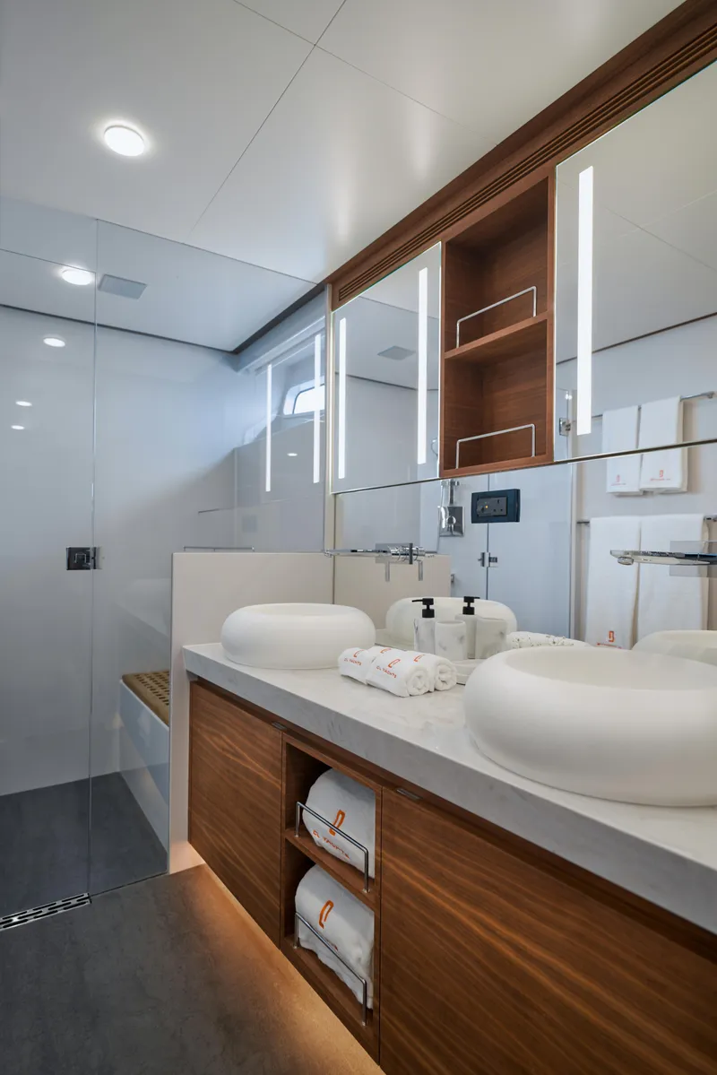 Slide: The Image of Luxurious bathroom in 2024 CL Yachts CLB65, featuring modern fixtures and elegant wood accents. - 24