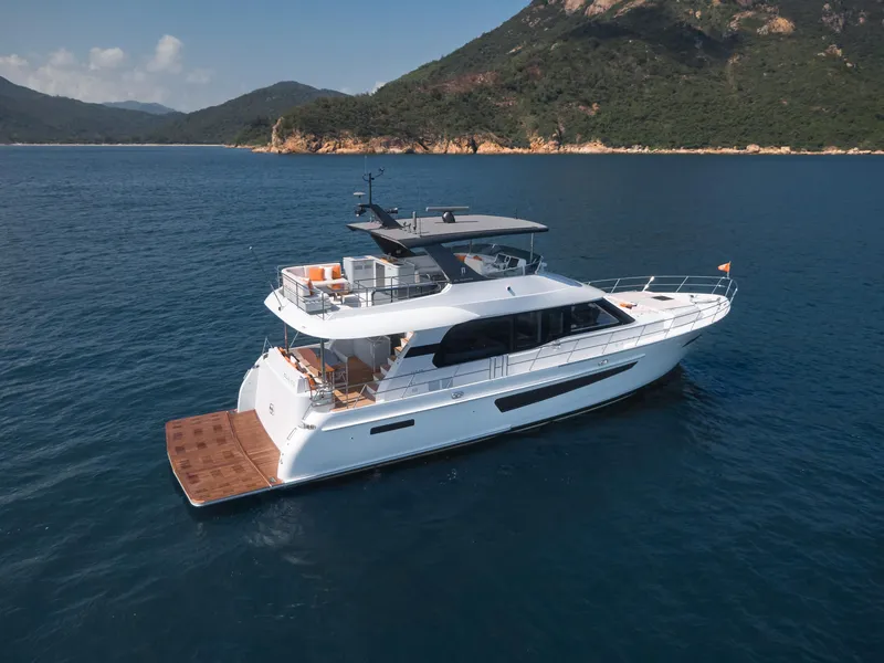 Slide: The Image of 2024 CL Yachts CLB65 luxury yacht cruising in scenic coastal waters. - 5