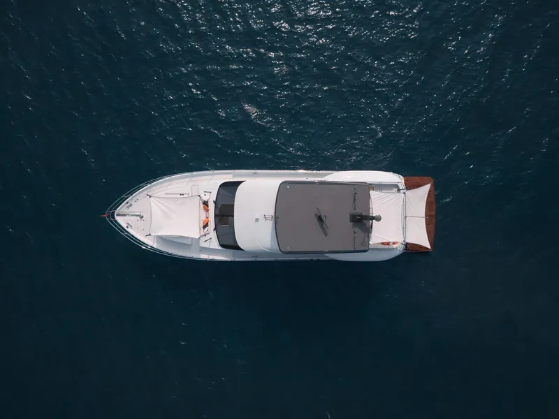 Slide: The Image of Aerial view of 2024 CL Yachts CLB65 luxury yacht on open water. - 6