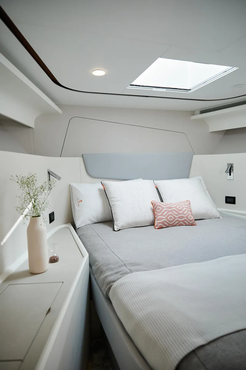 Slide: The Image of Luxurious 2024 CL Yachts CLB65 cabin interior with modern bedding and natural light. - 26