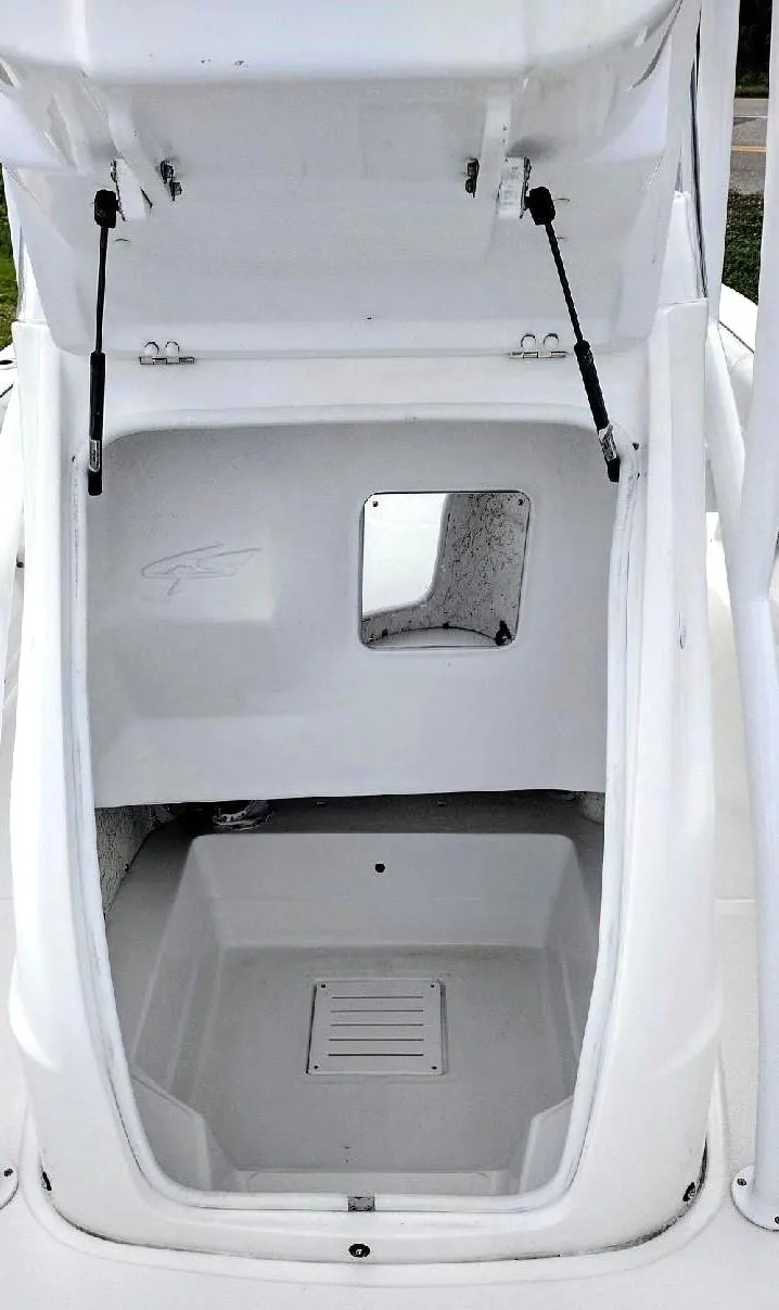 Slide: The Image of 2024 Glasstream 240 CCX boat storage compartment with open hatch. - 10