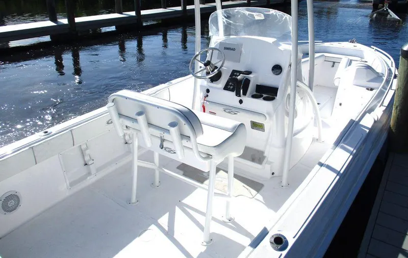 Slide: The Image of 2024 Glasstream 240 CCX boat interior with steering console and seating. - 5