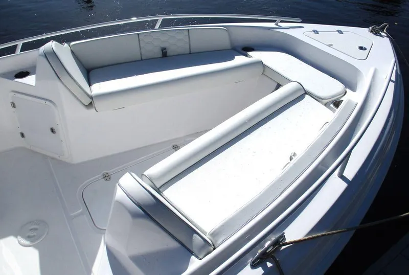 Slide: The Image of 2024 Glasstream 240 CCX boat interior with white seating and sleek design. - 7
