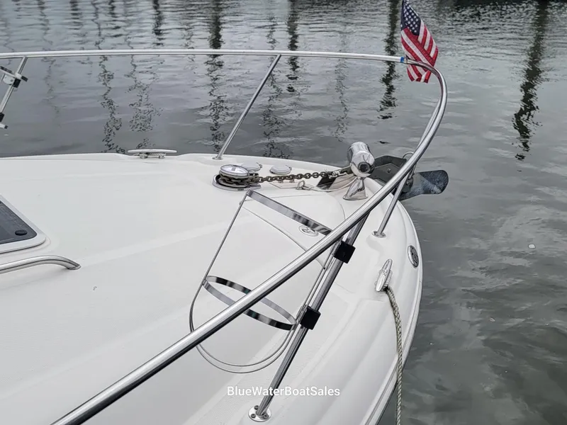 Slide: The Image of 2006 Sea Ray 320 Sundancer boat bow with American flag and anchor chain. - 10