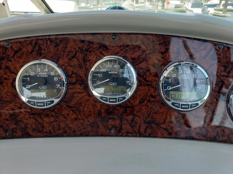 Slide: The Image of Dashboard of 2006 Sea Ray 320 Sundancer with speedometer and tachometers. - 13