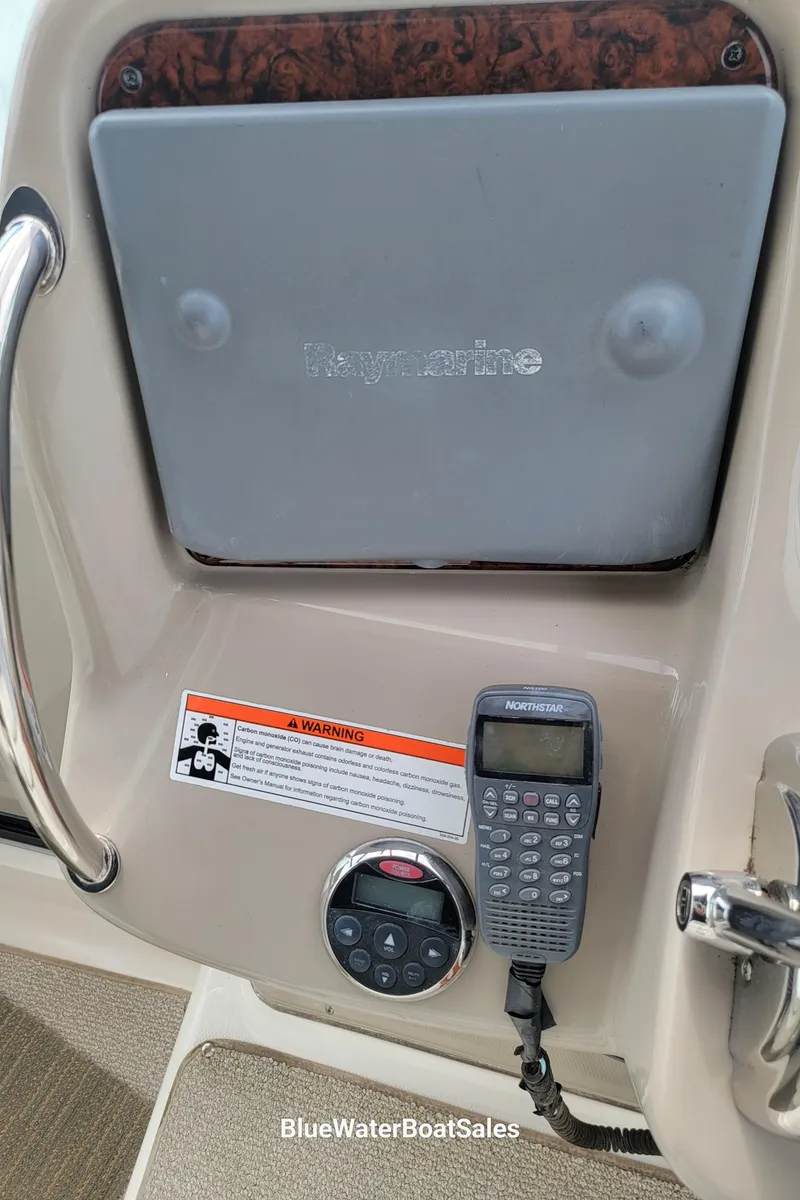 Slide: The Image of Control panel of a 2006 Sea Ray 320 Sundancer with Raymarine equipment. - 15