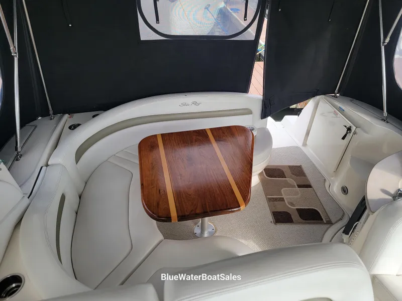Slide: The Image of Interior of 2006 Sea Ray 320 Sundancer with elegant seating and wooden table. - 16