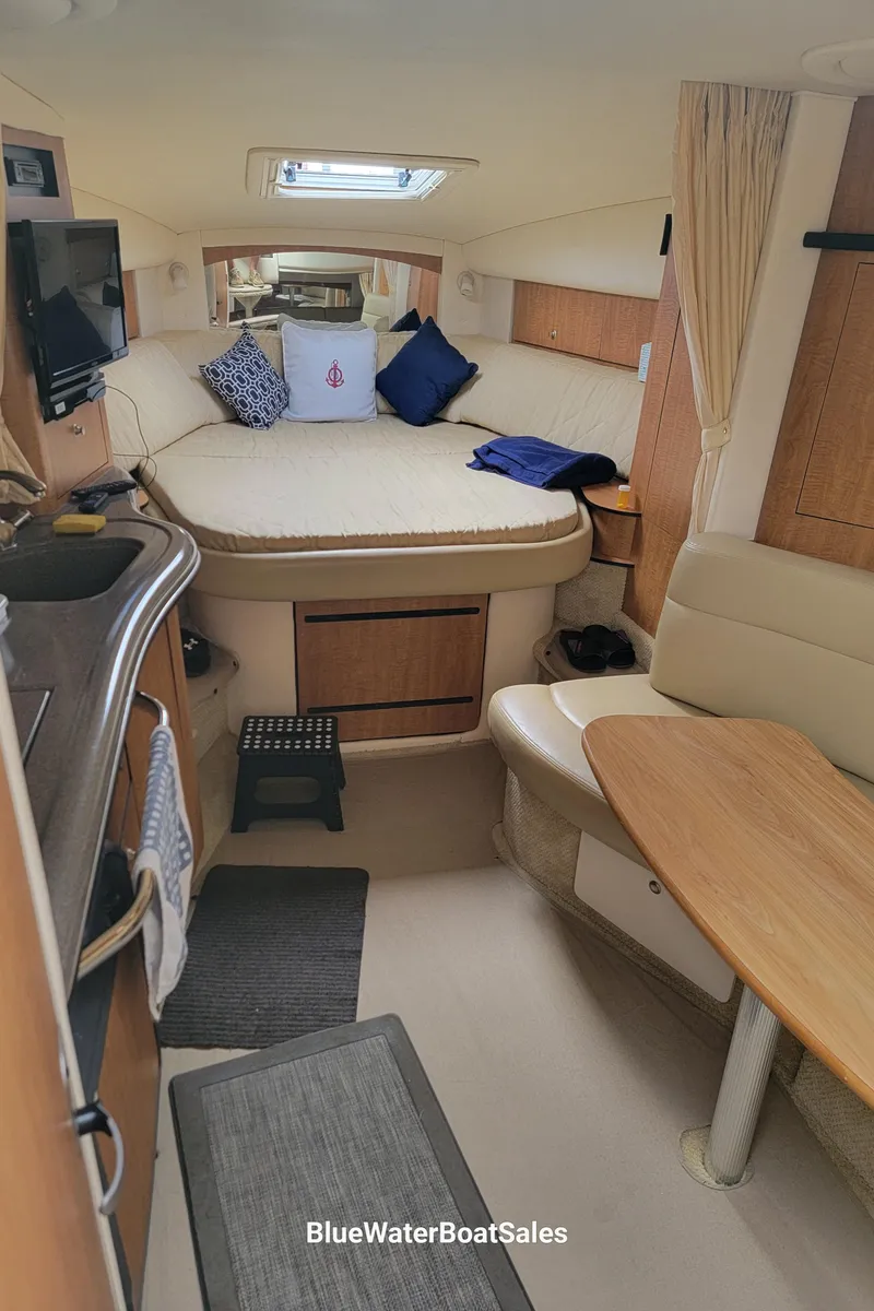 Slide: The Image of Interior of 2006 Sea Ray 320 Sundancer with cozy seating and modern amenities. - 28