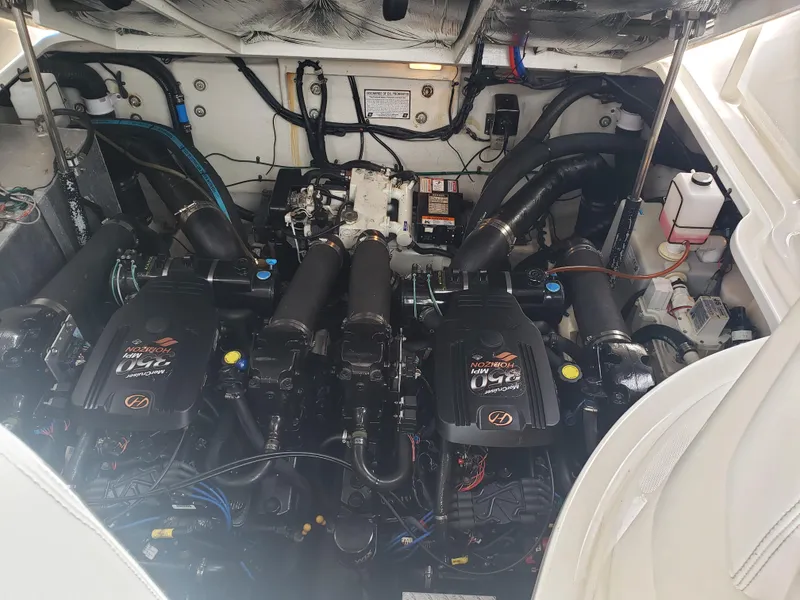 Slide: The Image of Engine compartment of a 2006 Sea Ray 320 Sundancer boat, showcasing dual engines. - 43