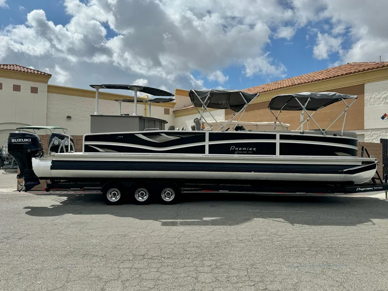 The Image of 2019 Premier Accolade 310 pontoon boat with Suzuki engine on trailer. - 0