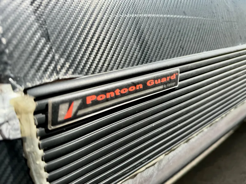 Slide: The Image of Close-up of 2019 Premier Accolade 310 Pontoon Guard with carbon fiber texture. - 10