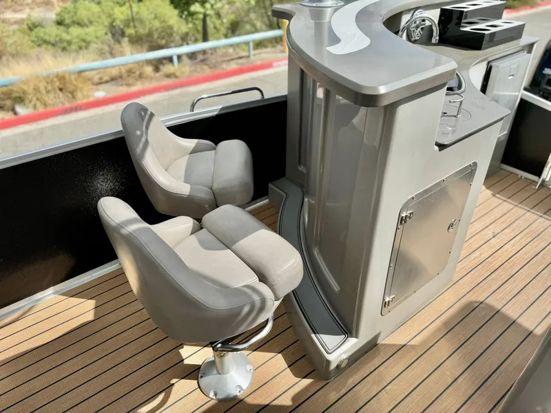 Slide: The Image of Premier Accolade 310 boat interior, 2019 model, featuring sleek seating and modern helm station. - 17