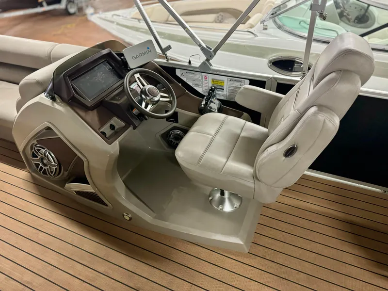 Slide: The Image of Premier Accolade 310 boat helm with Garmin system, 2019 model, on teak deck. - 20