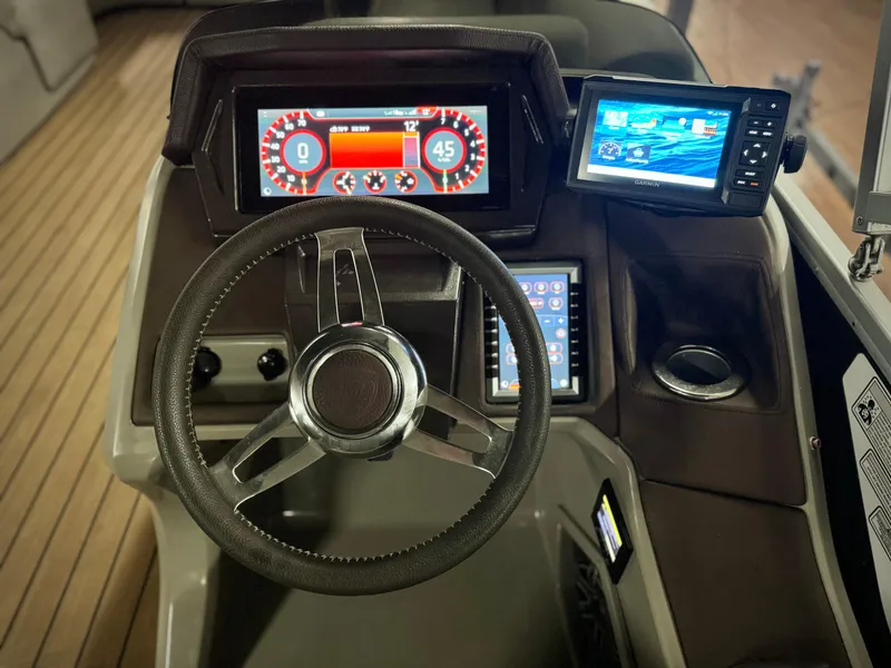 Slide: The Image of Steering console of 2019 Premier Accolade 310 with digital displays and controls. - 21
