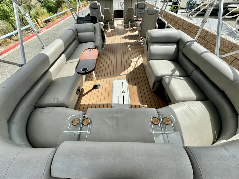 Slide: The Image of 2019 Premier Accolade 310 pontoon boat with spacious seating and modern interior design. - 25