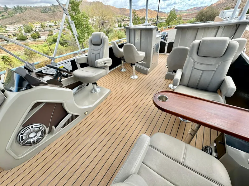 Slide: The Image of 2019 Premier Accolade 310 boat interior with plush seating and sleek design. - 28