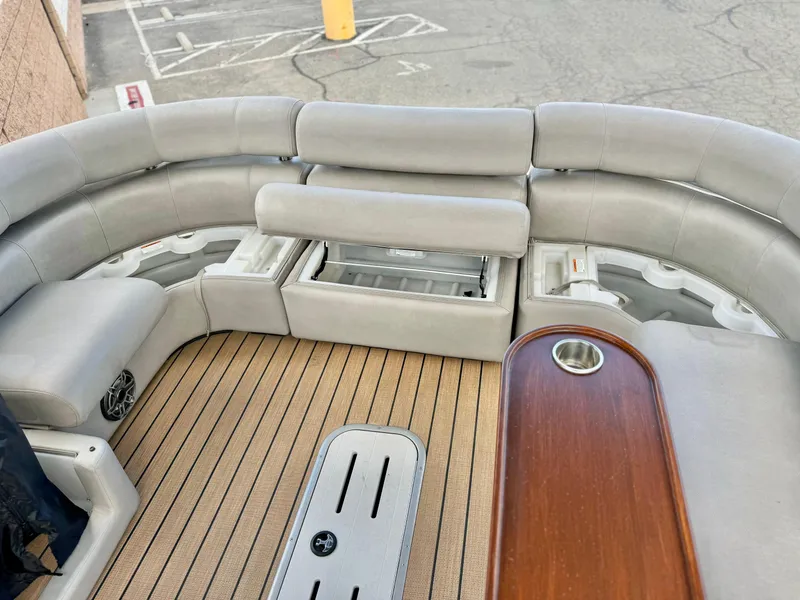 Slide: The Image of Premier Accolade 310 boat interior, 2019 model, featuring plush seating and wood accents. - 32