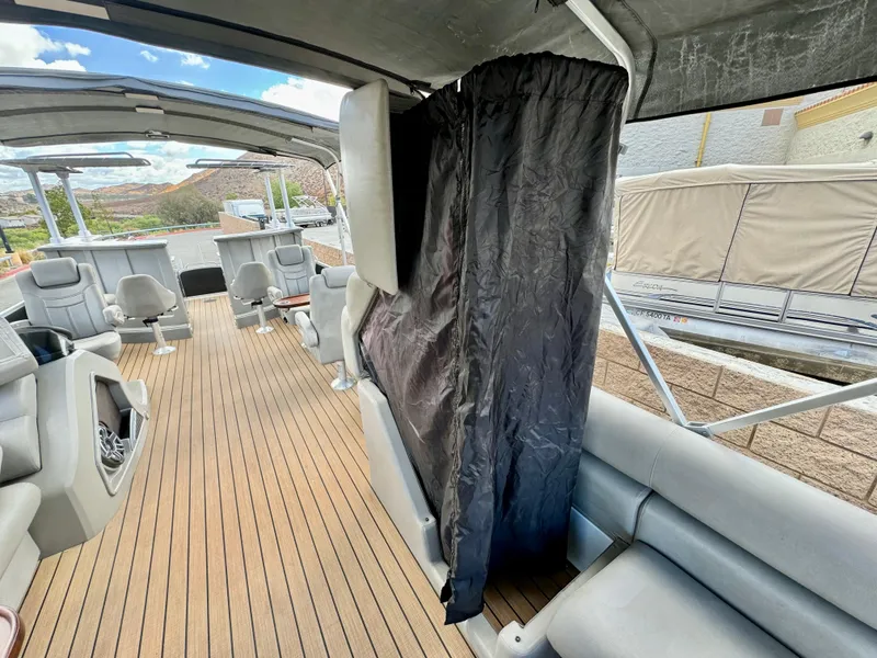 Slide: The Image of 2019 Premier Accolade 310 boat interior with wood flooring and seating. - 33