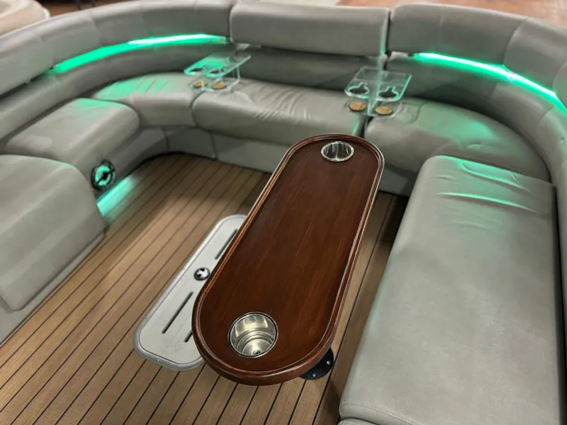 Slide: The Image of Luxurious 2019 Premier Accolade 310 boat interior with LED lighting and wooden table. - 41