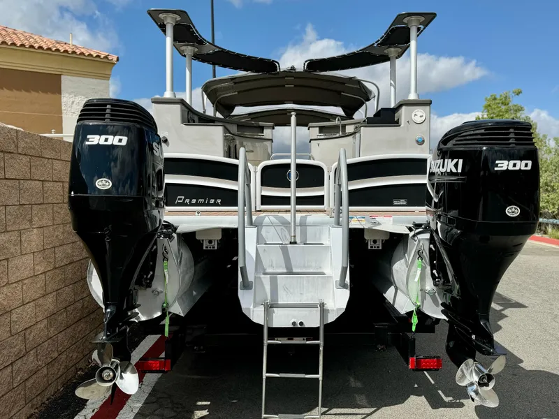 Slide: The Image of 2019 Premier Accolade 310 boat with dual Suzuki 300 engines, rear view. - 5