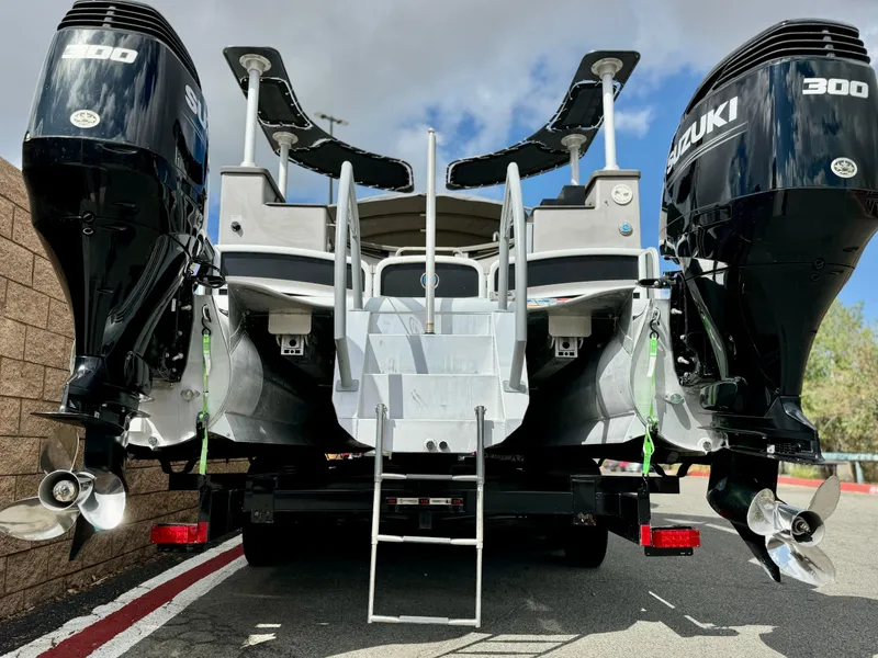 Slide: The Image of 2019 Premier Accolade 310 boat with dual Suzuki 300 engines, rear view. - 6