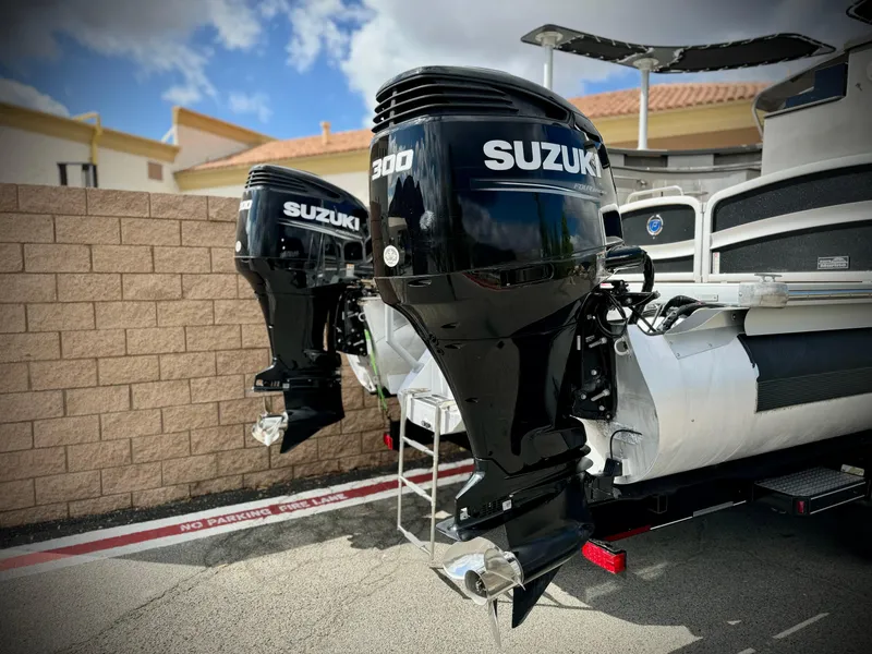 Slide: The Image of Premier Accolade 310 boat with dual Suzuki 300 outboard motors, 2019 model. - 8